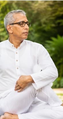 Guruji demonstrating Half Spinal Twist